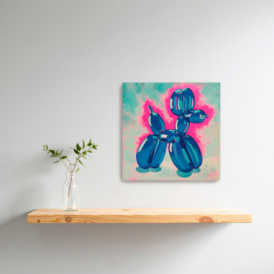 Canvas painting of a blue balloon dog on a light gray wall above a wooden shelf with a plant.