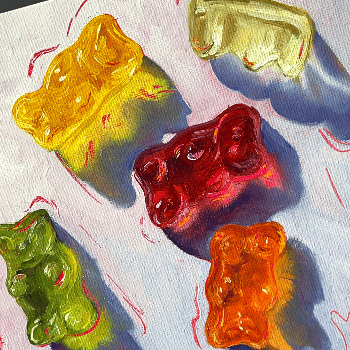 Colorful gummy bears on a textured surface