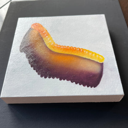 A square canvas painting of a gummy worm gummy candy