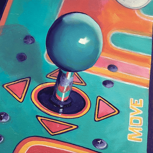 Close-up of a joystick on a colorful arcade machine panel with 'MOVE' text.
